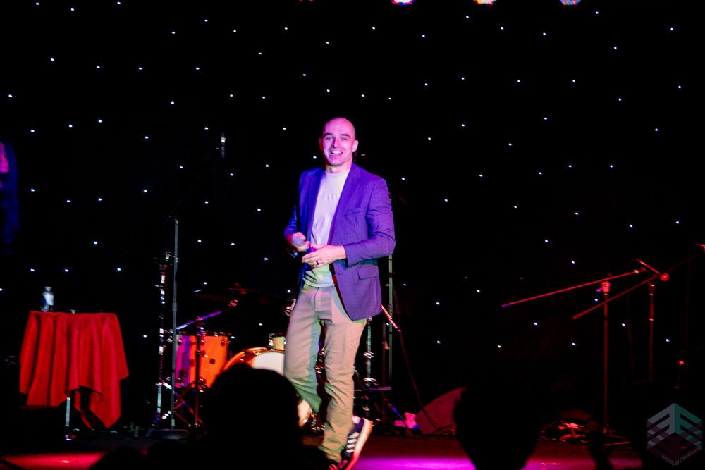 Host smiling on stage